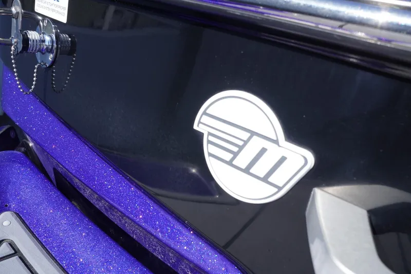 Slide: The Image of 2022 Malibu Wakesetter 23 LSV boat with logo on sleek, glossy surface. - 11