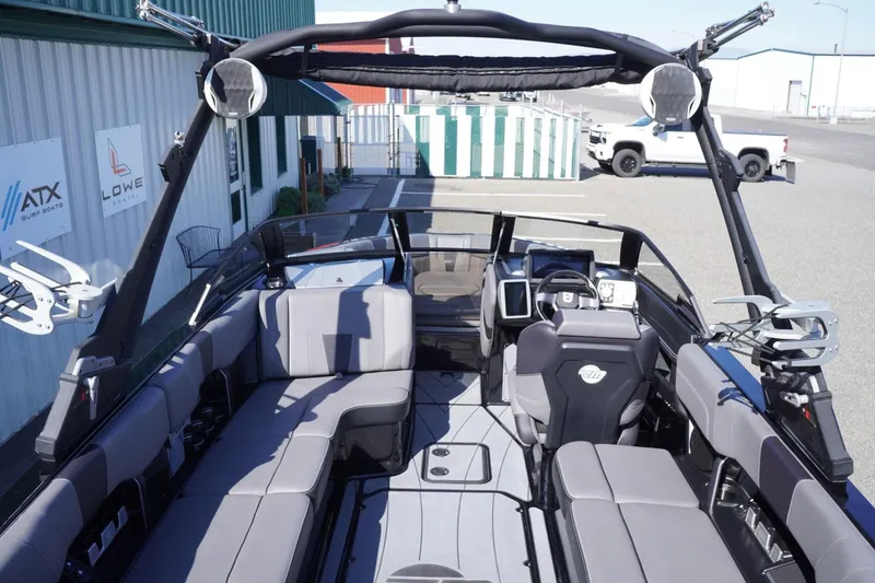 Slide: The Image of 2022 Malibu Wakesetter 23 LSV interior with spacious seating and modern dashboard. - 18