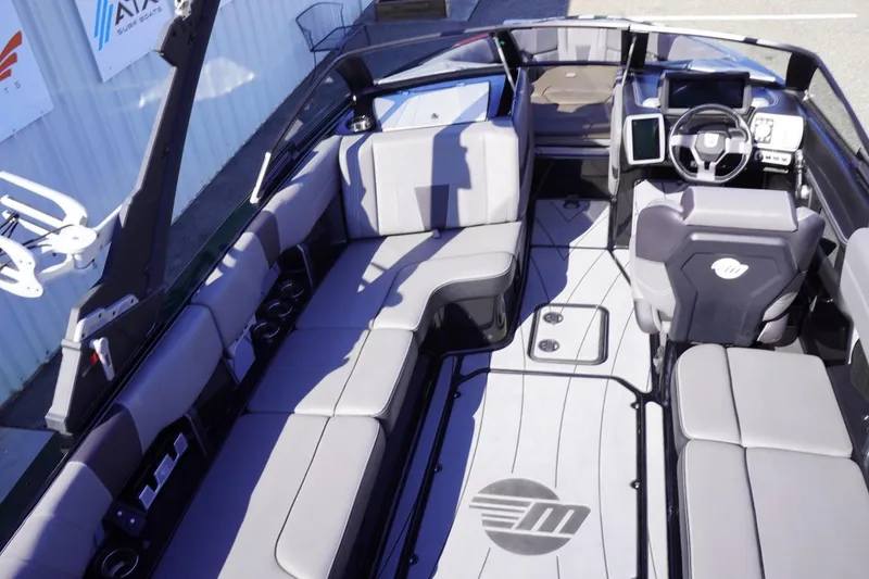 Slide: The Image of 2022 Malibu Wakesetter 23 LSV interior with spacious seating and modern dashboard. - 21