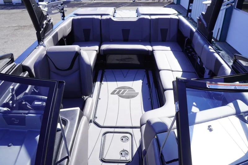 Slide: The Image of 2022 Malibu Wakesetter 23 LSV interior with spacious seating and sleek design. - 26