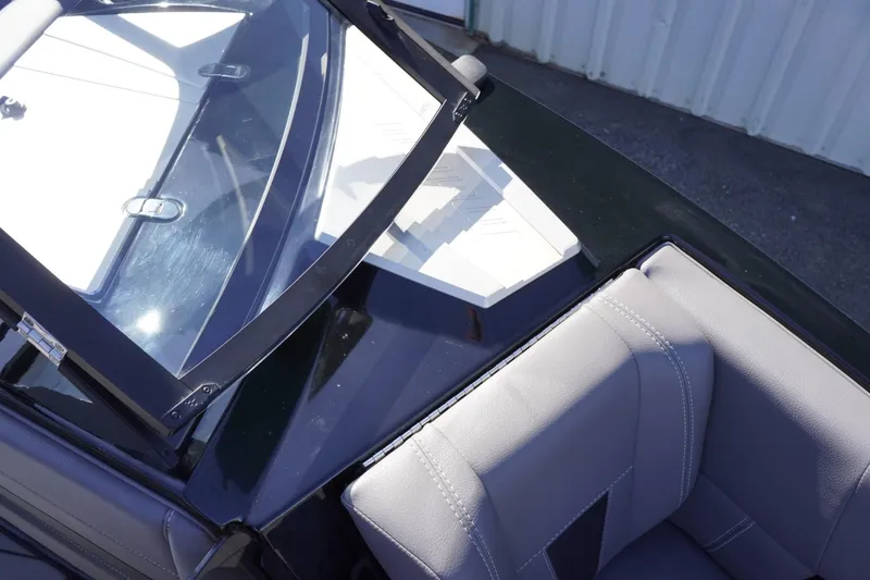 Slide: The Image of 2022 Malibu Wakesetter 23 LSV boat interior with windshield and seating detail. - 29