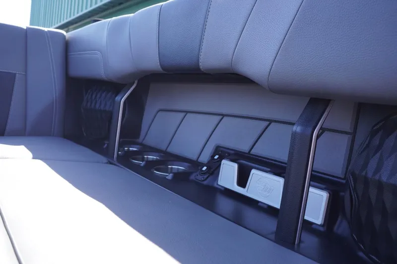 Slide: The Image of 2022 Malibu Wakesetter 23 LSV interior seating with cup holders and sleek design. - 32