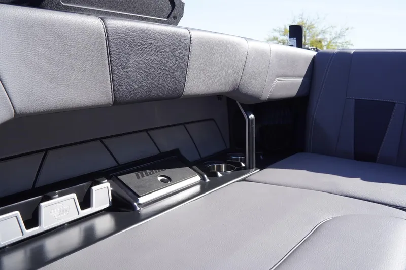 Slide: The Image of 2022 Malibu Wakesetter 23 LSV interior seating with sleek gray upholstery and storage compartments. - 33