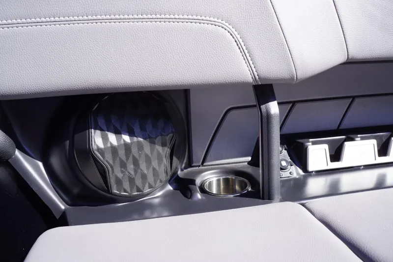 Slide: The Image of Interior of 2022 Malibu Wakesetter 23 LSV with speaker and cup holder. - 34