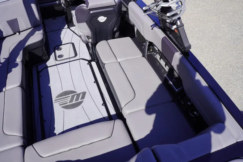Slide: The Image of 2022 Malibu Wakesetter 23 LSV interior with gray seating and logo on the floor. - 37