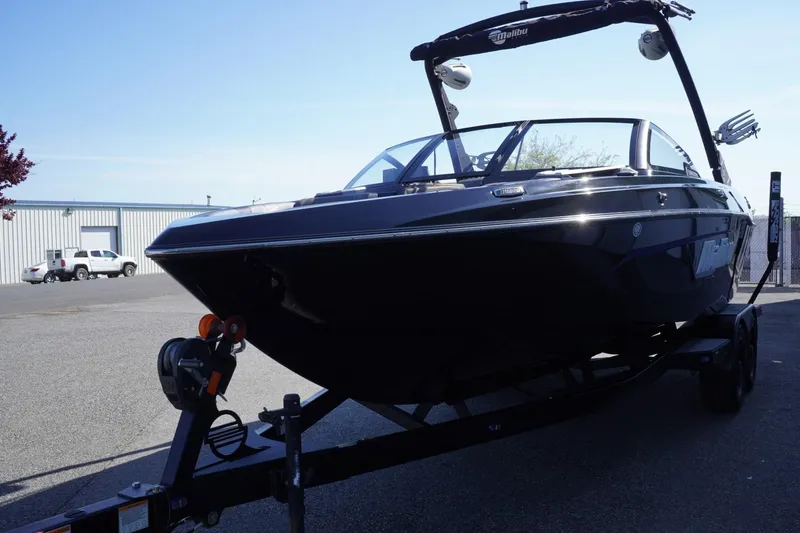 Slide: The Image of 2022 Malibu Wakesetter 23 LSV boat on trailer, parked outdoors. - 4