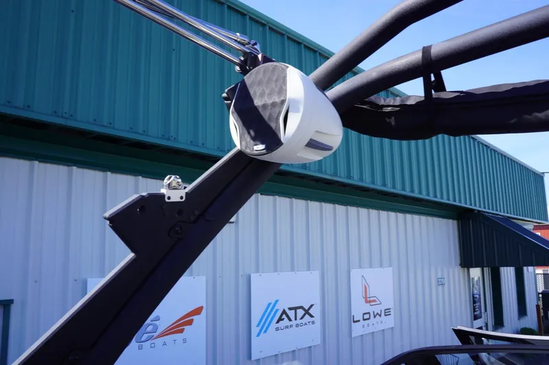 Slide: The Image of 2022 Malibu Wakesetter 23 LSV boat speaker on a tower, with dealership signs in background. - 45