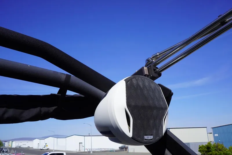 Slide: The Image of 2022 Malibu Wakesetter 23 LSV boat speaker against clear blue sky. - 48