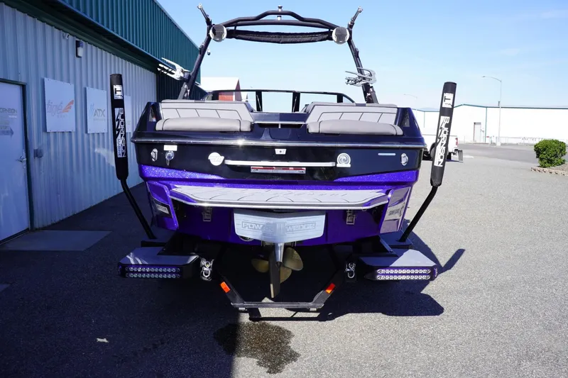 Slide: The Image of 2022 Malibu Wakesetter 23 LSV boat, rear view, parked outdoors. - 7