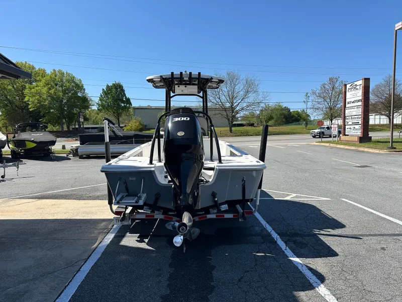 Slide: The Image of 2022 Sea Pro 248 DLX boat with 300 HP engine in a parking lot. - 8