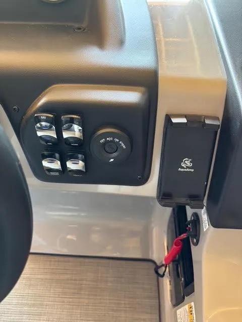 Slide: The Image of Control panel of 2025 Lowe LS210 boat with ignition switch and accessory buttons. - 13