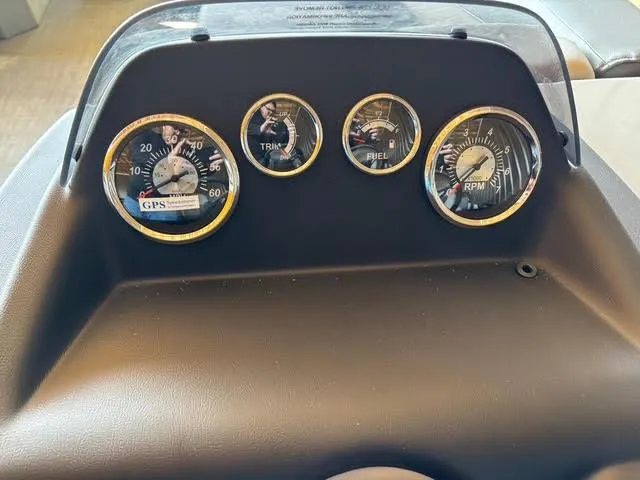 Slide: The Image of Dashboard of 2025 Lowe LS210 boat with speedometer, trim, fuel, and RPM gauges. - 14