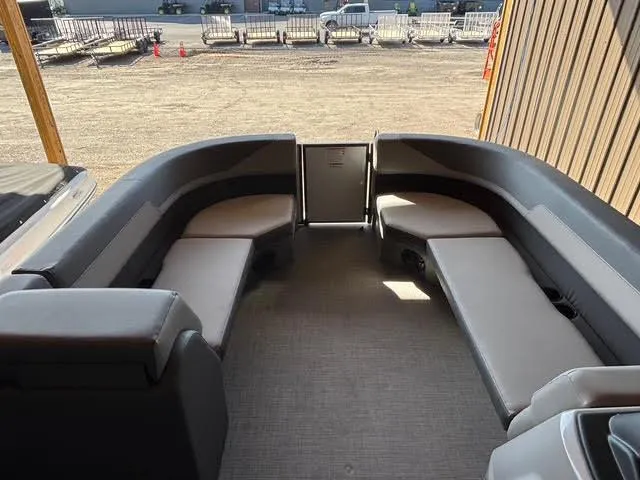 Slide: The Image of Interior of 2025 Lowe LS210 boat with spacious seating and modern design. - 8