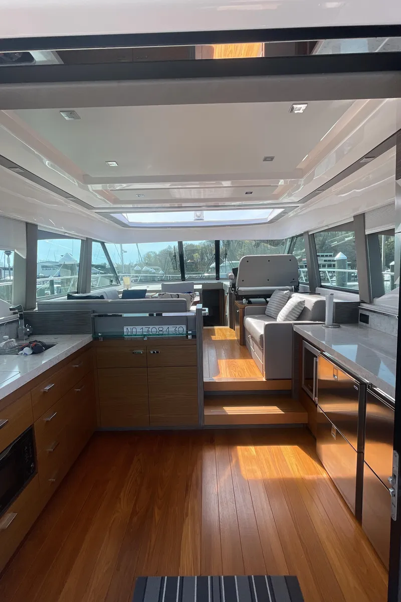 Slide: The Image of 2020 Tiara Yachts 53 Coupe interior with modern kitchen and seating area. - 10