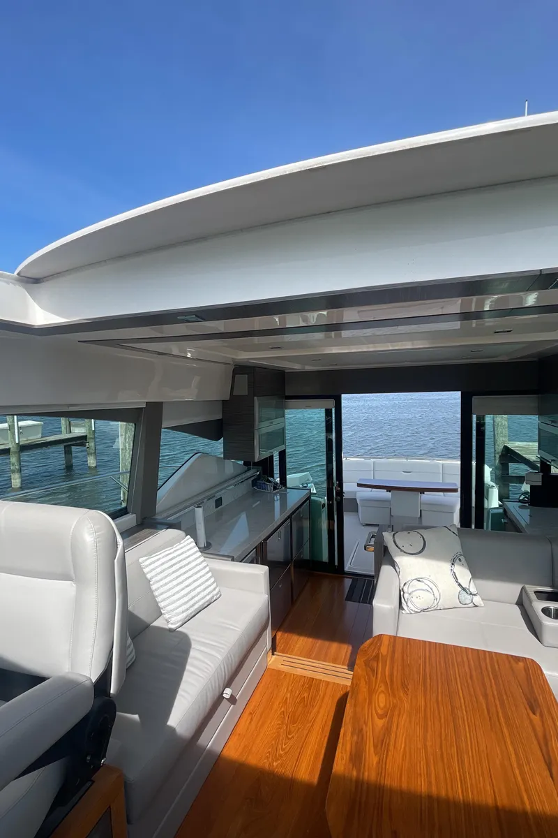 Slide: The Image of 2020 Tiara Yachts 53 Coupe interior with modern design and ocean view. - 16
