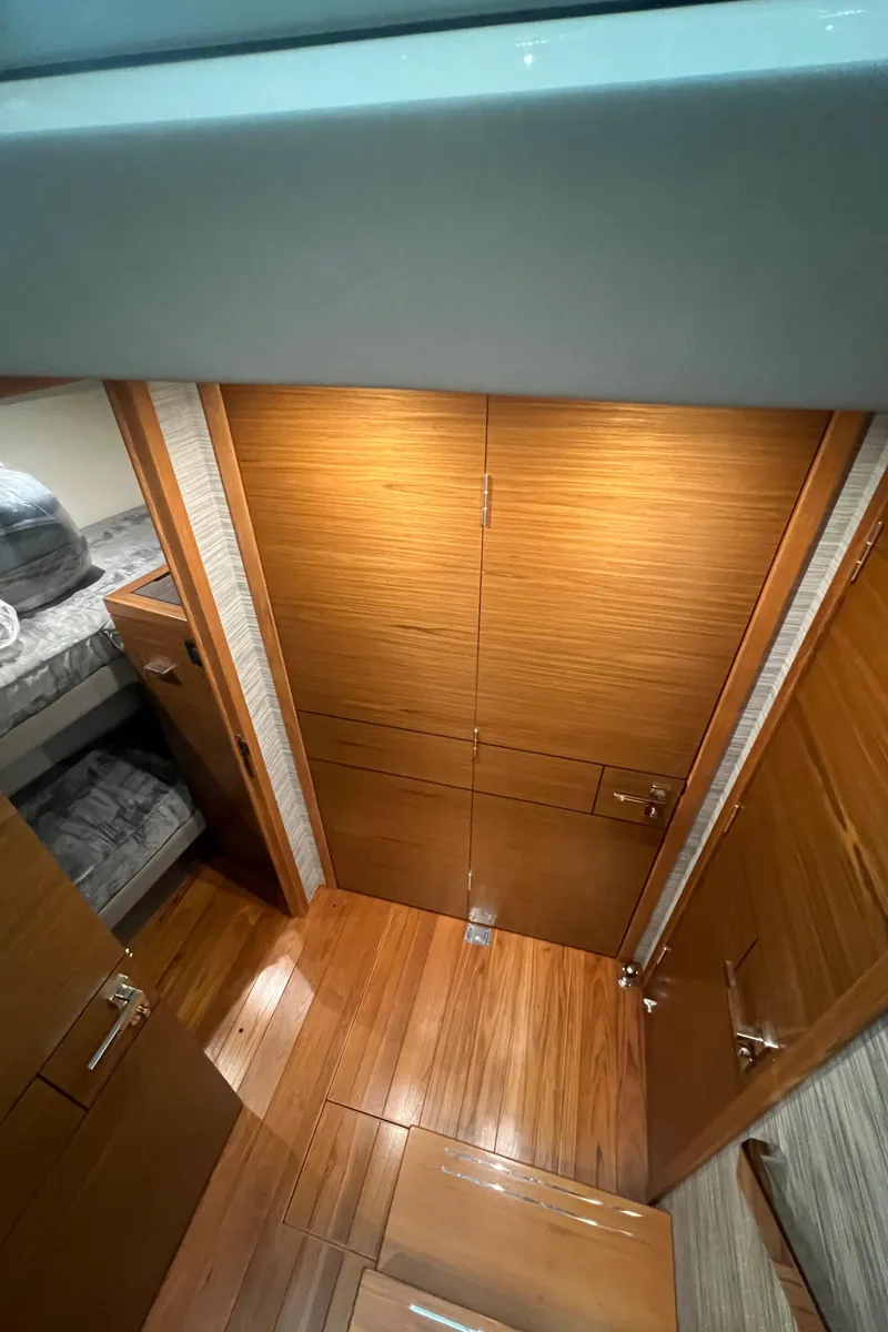 Slide: The Image of 2020 Tiara Yachts C53 Coupe interior with wooden flooring and cabinetry. - 20