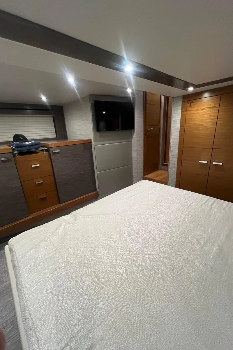 Slide: The Image of Luxurious interior of 2020 Tiara Yachts C53 Coupe with modern furnishings and ambient lighting. - 26