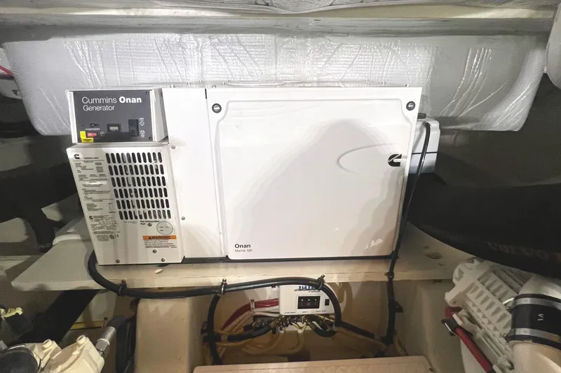Slide: The Image of Cummins Onan generator in 2020 Tiara Yachts C53 Coupe engine room. - 32