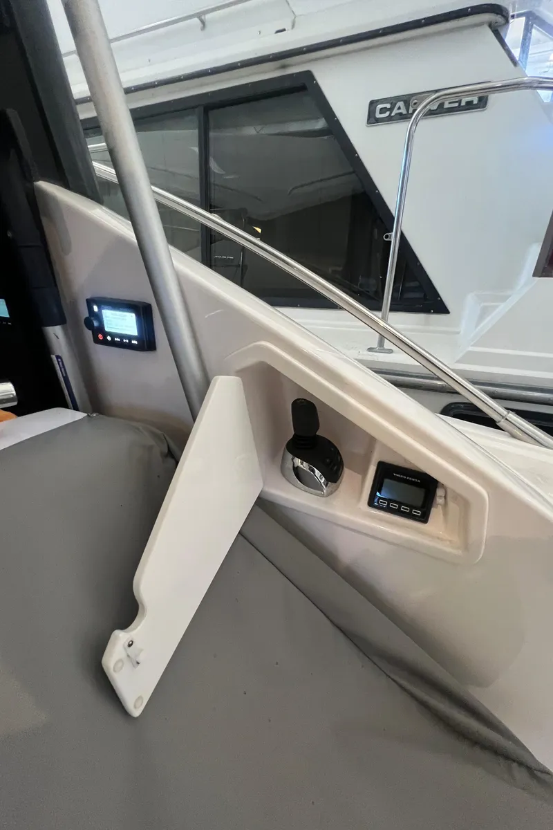 Slide: The Image of 2020 Tiara Yachts C53 Coupe interior dashboard with control panels and instruments. - 7