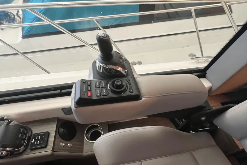 Slide: The Image of Control panel of 2020 Tiara Yachts C53 Coupe with joystick and buttons. - 9