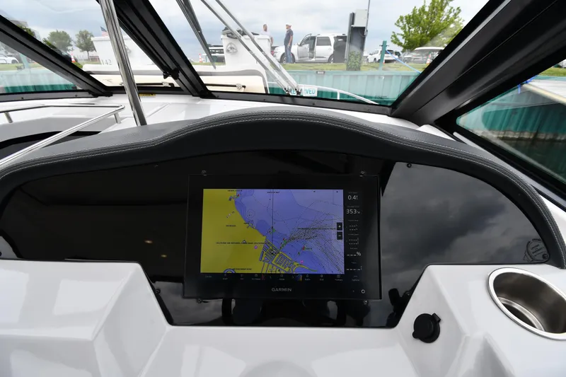 Slide: The Image of 2021 Regal 35 Sport Coupe dashboard with navigation display, showcasing modern boating technology. - 13