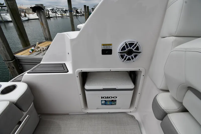 Slide: The Image of 2021 Regal 35 Sport Coupe interior with Igloo cooler and speaker, docked at marina. - 27