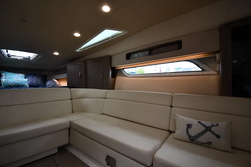 Slide: The Image of Luxurious interior of 2021 Regal 35 Sport Coupe with plush seating and nautical decor. - 39