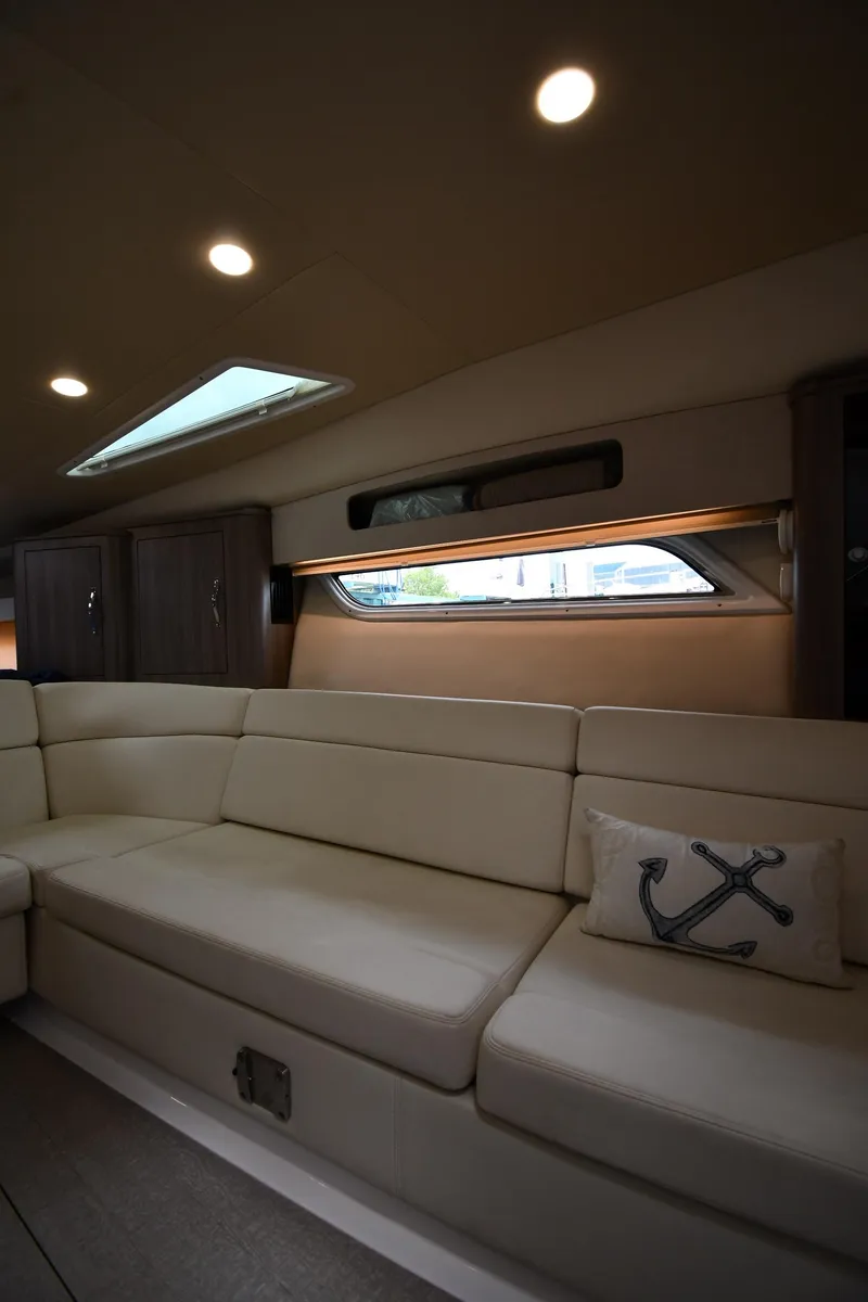 Slide: The Image of Luxurious interior of 2021 Regal 35 Sport Coupe with plush seating and nautical decor. - 40