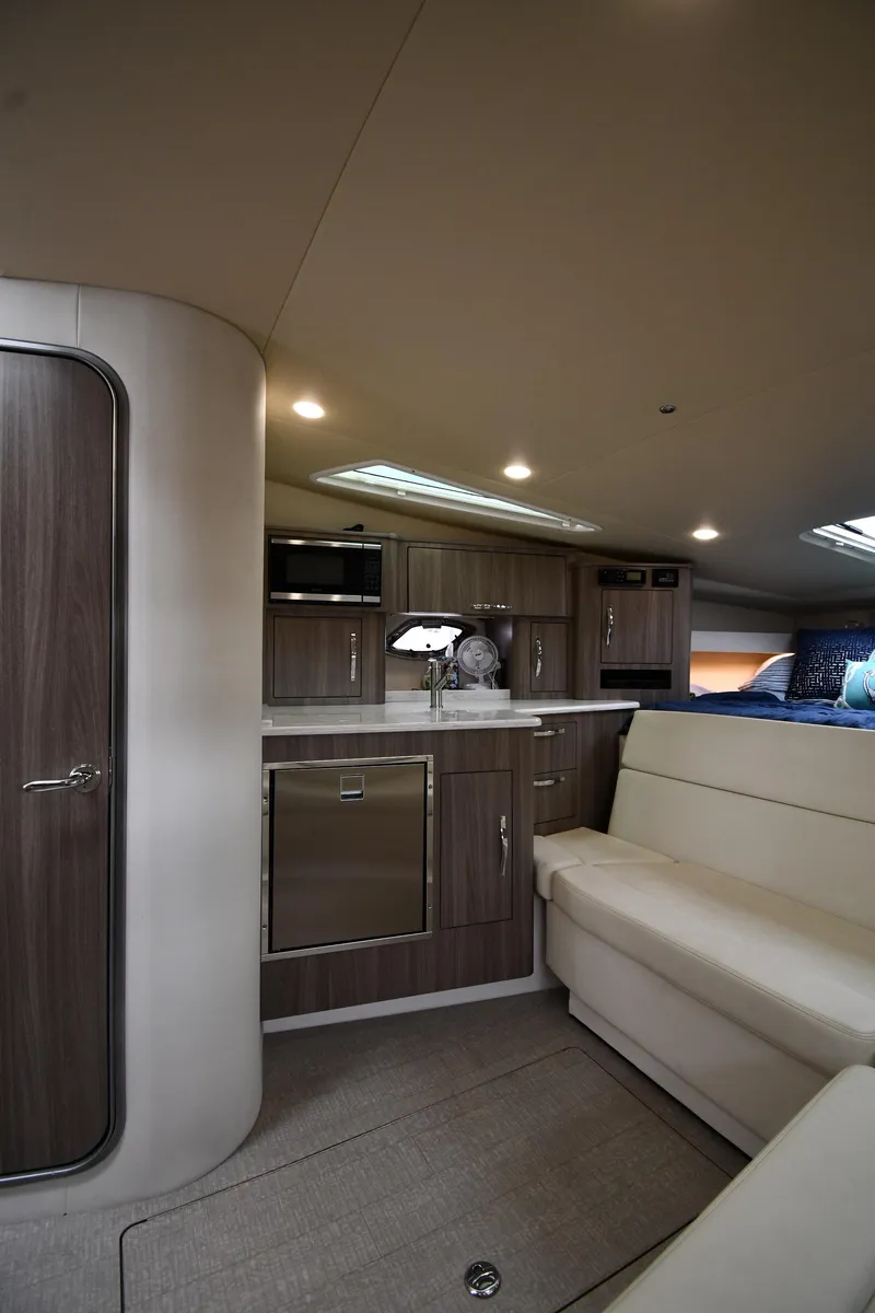 Slide: The Image of 2021 Regal 35 Sport Coupe interior with modern kitchen and seating area. - 42