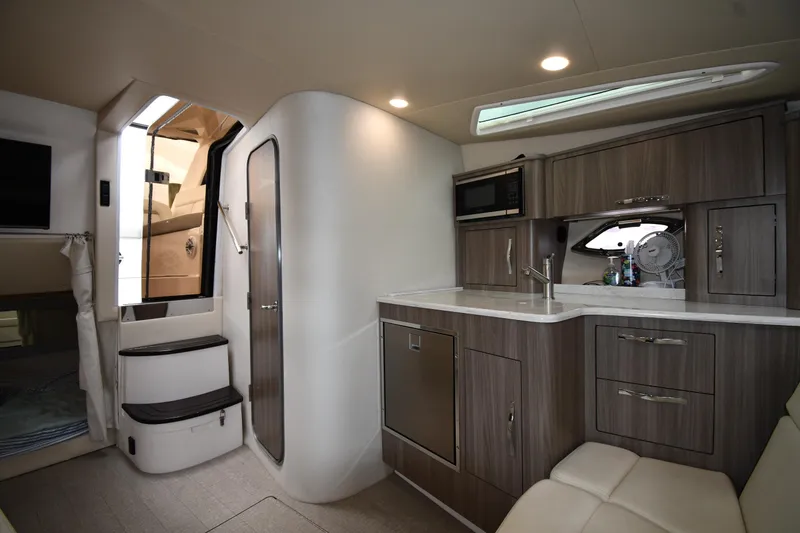 Slide: The Image of Interior of 2021 Regal 35 Sport Coupe, featuring modern kitchen and seating area. - 43