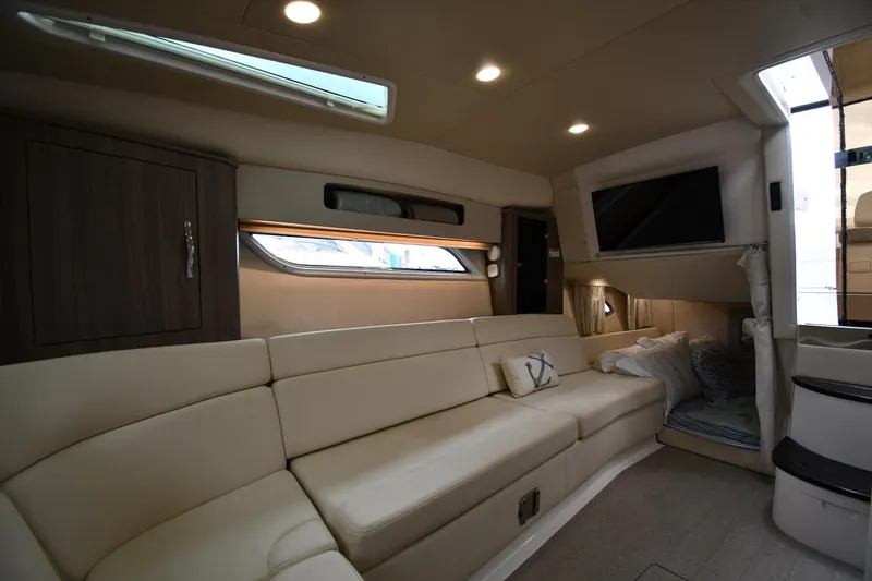 Slide: The Image of Luxurious interior of 2021 Regal 35 Sport Coupe with beige seating and modern amenities. - 45