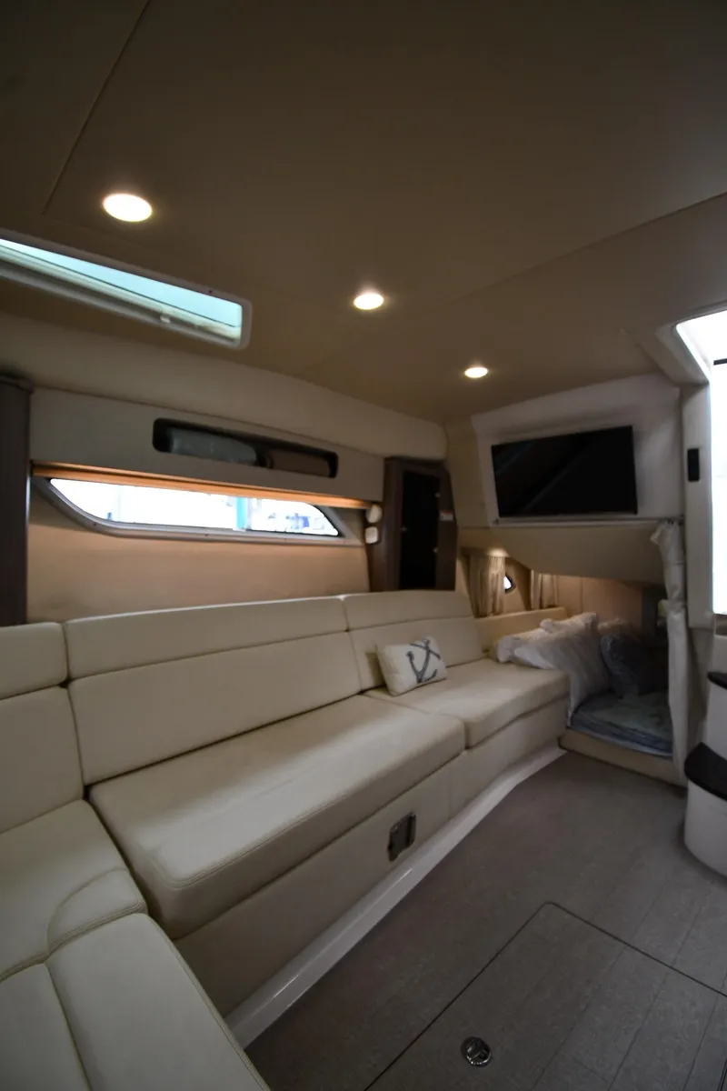 Slide: The Image of Luxurious interior of 2021 Regal 35 Sport Coupe with beige seating and modern lighting. - 46