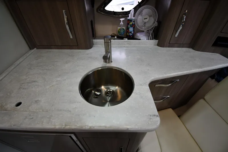 Slide: The Image of 2021 Regal 35 Sport Coupe kitchen area with sink and countertop. - 47
