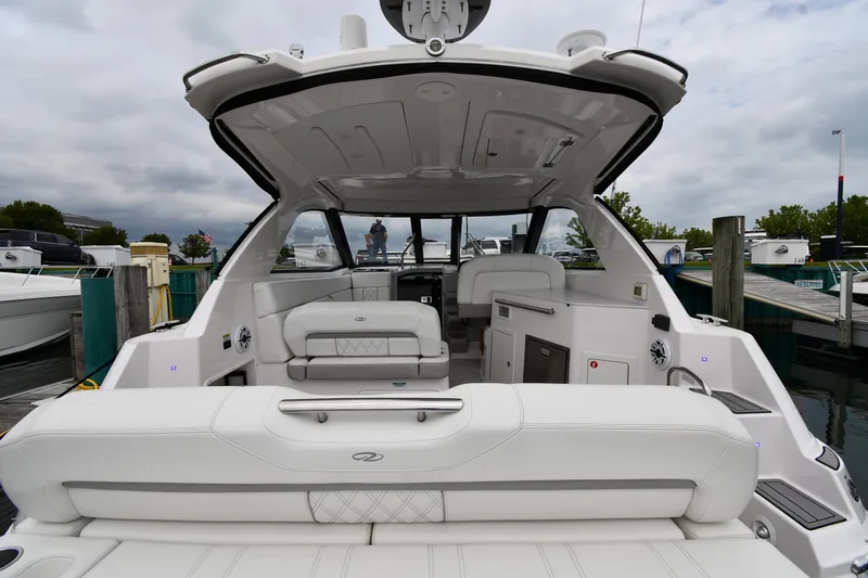 Slide: The Image of 2021 Regal 35 Sport Coupe boat interior with luxurious seating and modern design. - 8