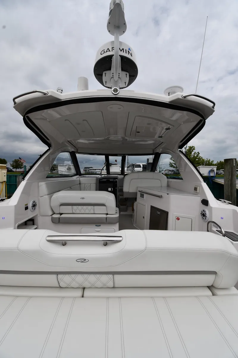 Slide: The Image of 2021 Regal 35 Sport Coupe boat with spacious interior and modern design. - 9