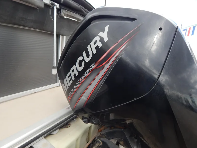 Slide: The Image of Mercury FourStroke engine on 2016 Cypress Cay Seabreeze 230 boat. - 10