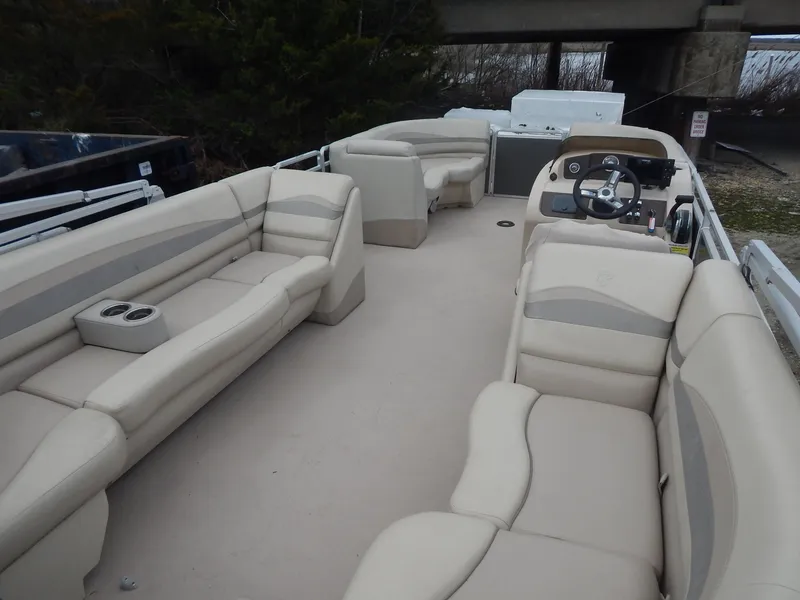 Slide: The Image of 2016 Cypress Cay Seabreeze 230 pontoon boat with spacious seating and modern helm. - 14