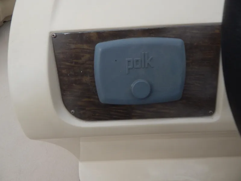 Slide: The Image of Polk audio component on 2016 Cypress Cay Seabreeze 230 boat dashboard. - 21