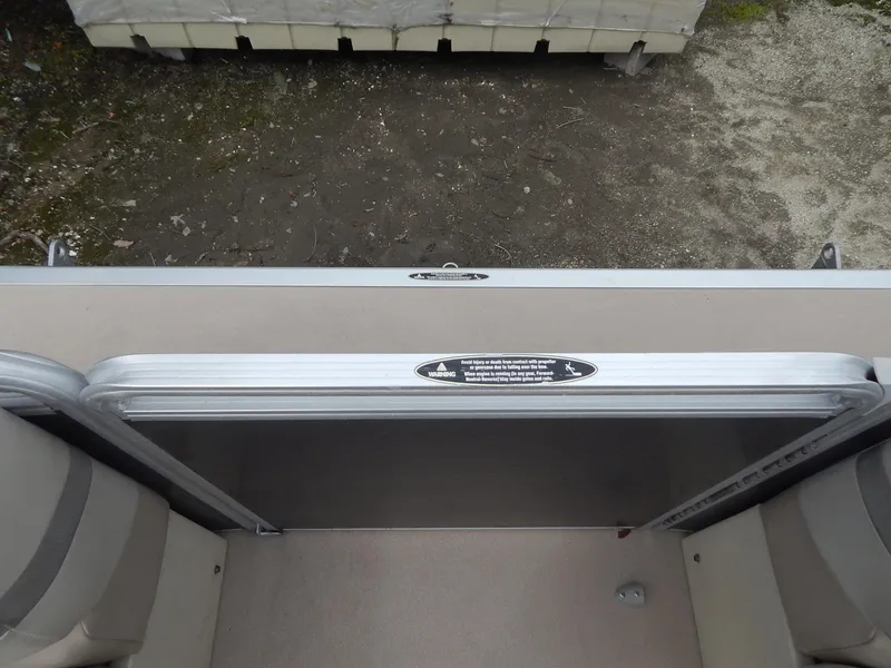 Slide: The Image of 2016 Cypress Cay Seabreeze 230 boat interior with open gate and seating. - 24