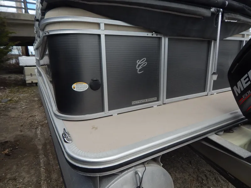 Slide: The Image of 2016 Cypress Cay Seabreeze 230 pontoon boat, side view with logo and Mercury engine. - 8