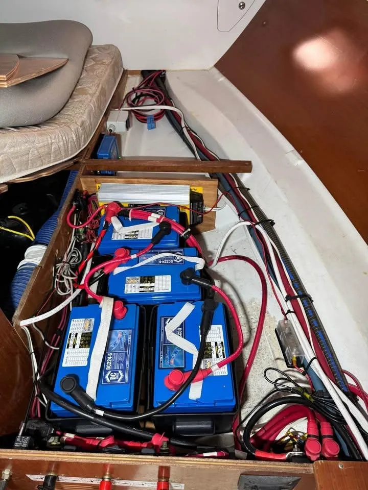 Slide: The Image of Battery compartment of a 2008 Beneteau Oceanis Clipper 343 sailboat, showing wiring and connections. - 11