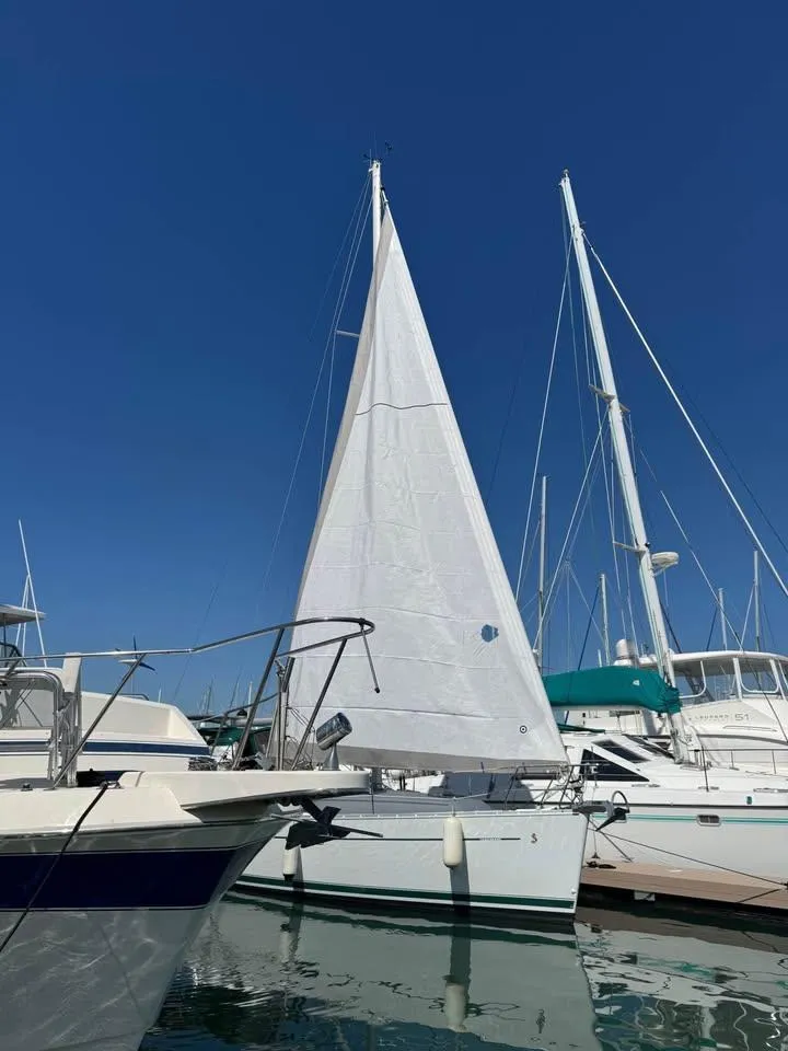 Slide: The Image of 2008 Beneteau Oceanis Clipper 343 sailboat docked in marina under clear blue sky. - 18