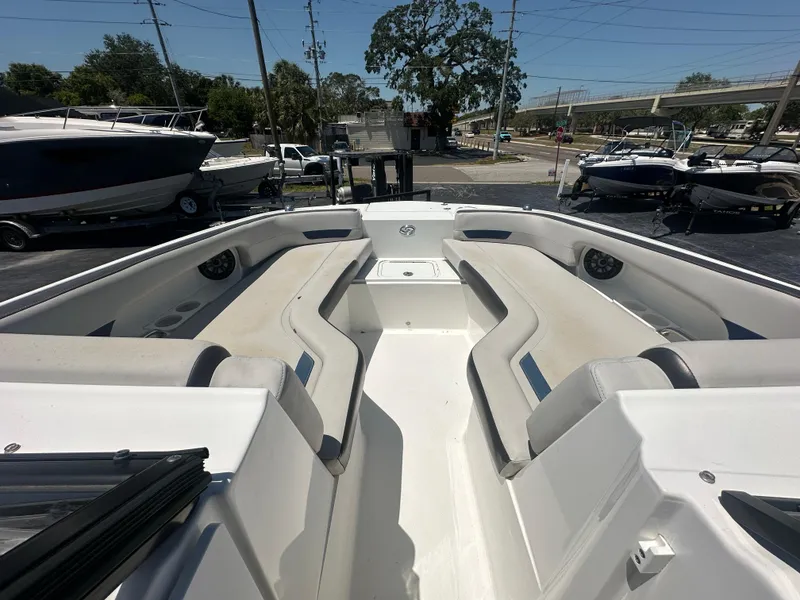 Slide: The Image of 2022 Hurricane SunDeck 235 OB boat interior with spacious seating and modern design. - 14