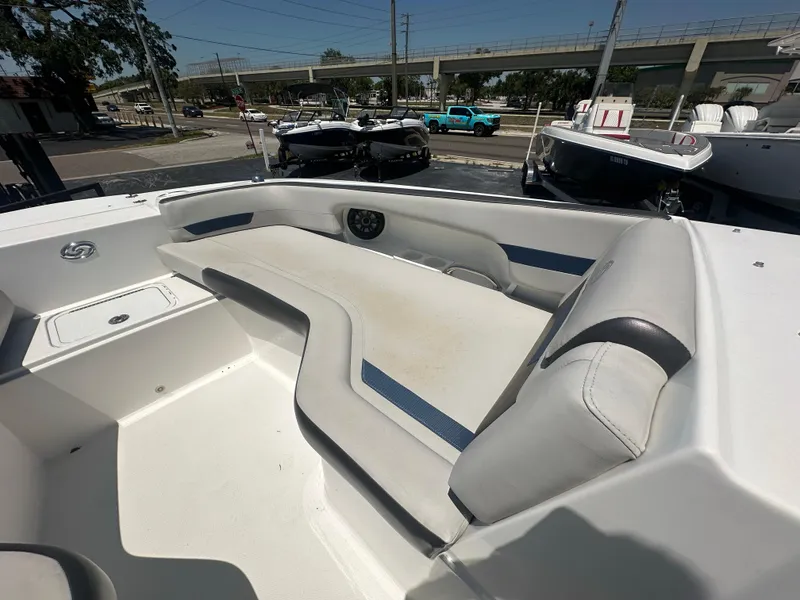 Slide: The Image of 2022 Hurricane SunDeck 235 OB boat interior with spacious seating and modern design. - 16