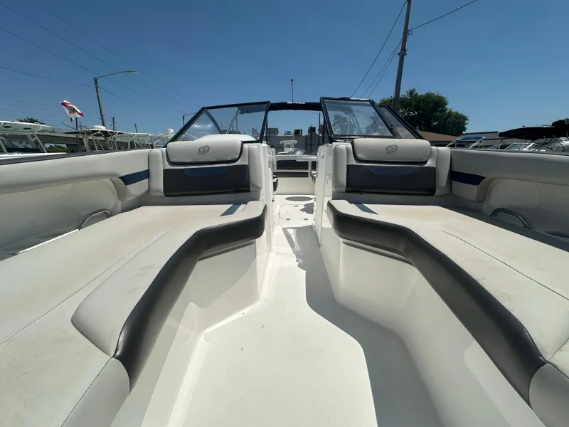Slide: The Image of 2022 Hurricane SunDeck 235 OB boat interior with spacious seating and sleek design. - 17