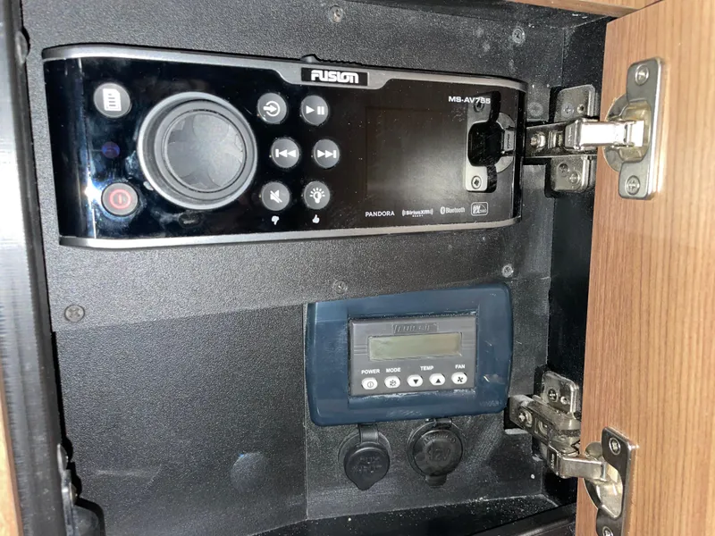 Slide: The Image of Fusion stereo system inside a 2019 Boston Whaler 315 Conquest cabinet. - 22