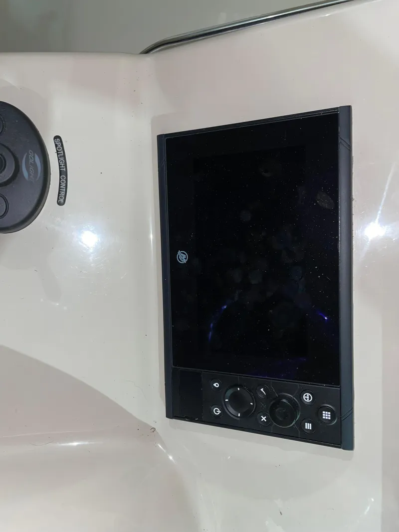 Slide: The Image of Control panel of a 2019 Boston Whaler 315 Conquest boat. - 28