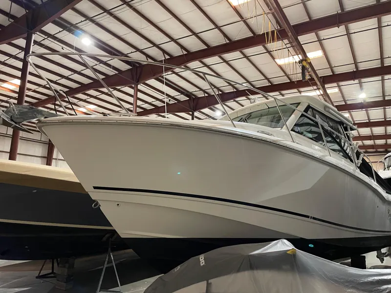 Slide: The Image of 2019 Boston Whaler 315 Conquest boat in indoor storage facility. - 4