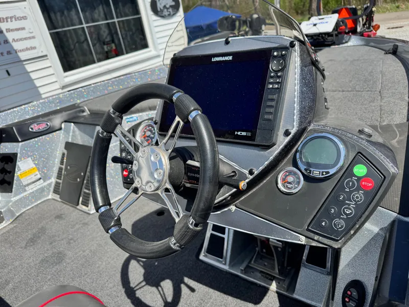 Slide: The Image of 2020 Ranger Z520C boat dashboard with steering wheel and electronic controls. - 5