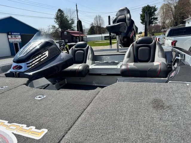 Slide: The Image of 2020 Ranger Z520C boat with dual seats and motor, parked outdoors. - 9